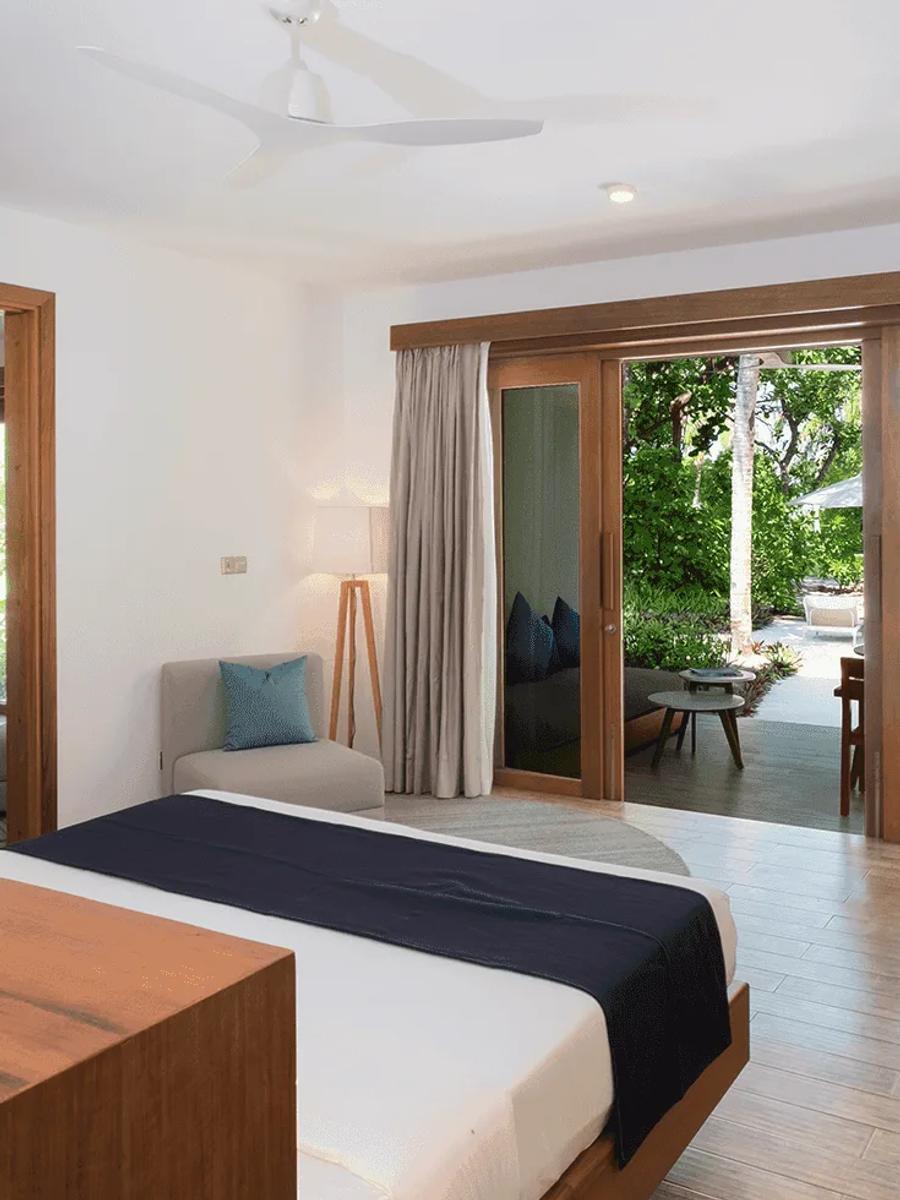 The interconnecting bedrooms of a Sunset Family Beach Suite at Ifuru Island Maldives