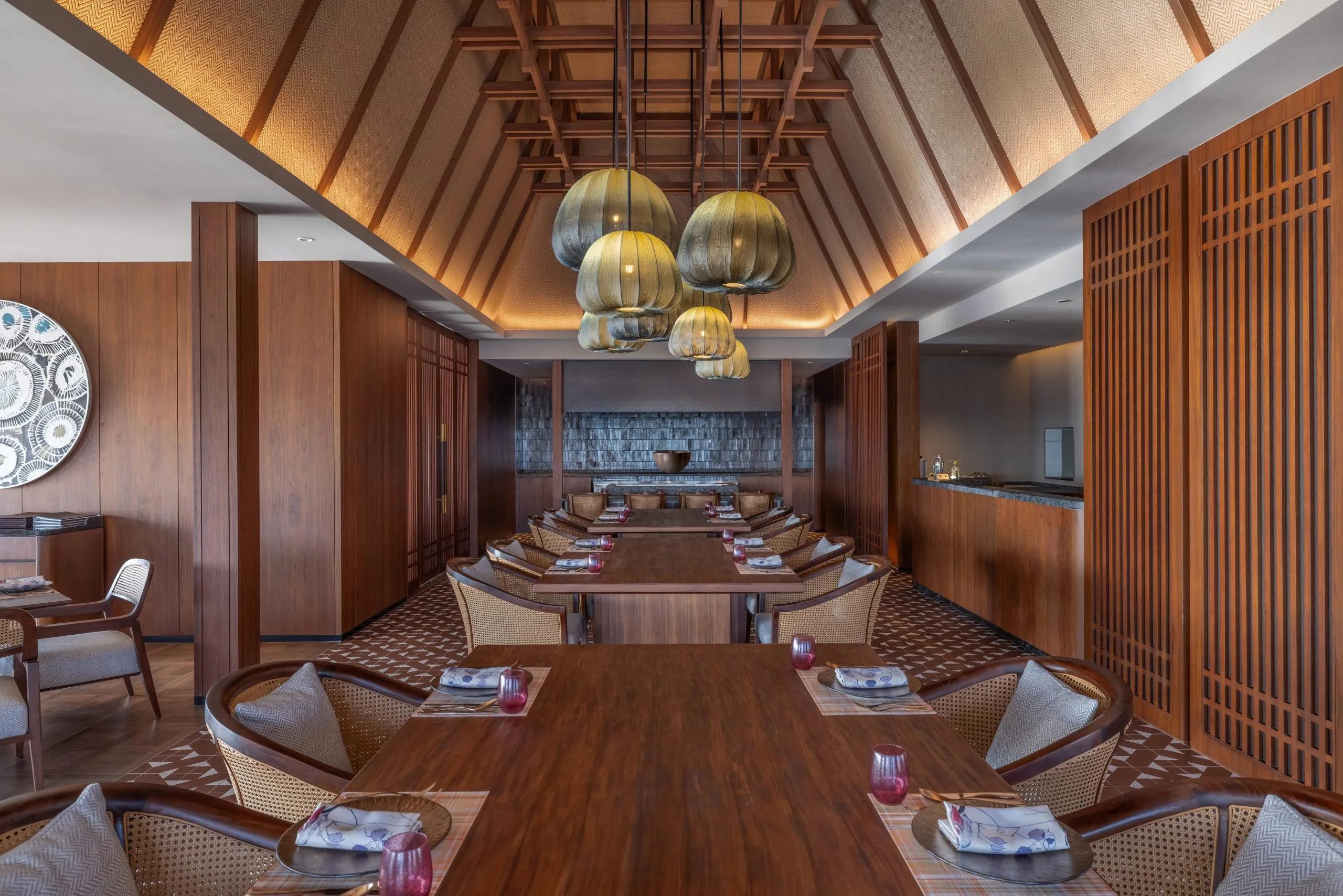 Bō's overwater dining room at dusitD2 Feydhoo Maldives, set for teppanyaki