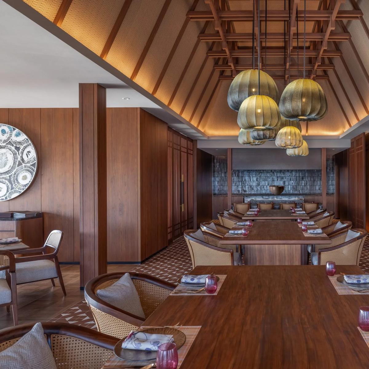 Bō's overwater dining room at dusitD2 Feydhoo Maldives, set for teppanyaki