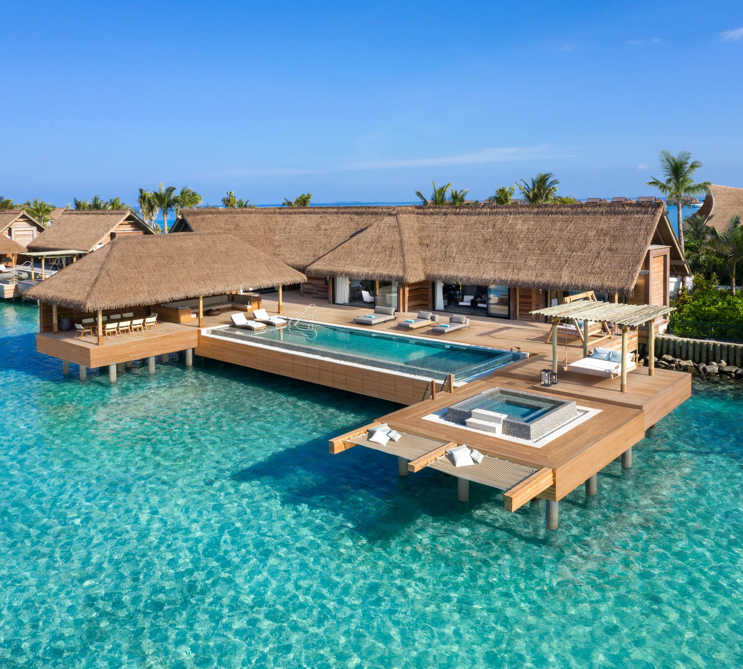 A reef-set villa at Waldorf Astoria Maldives Ithaafushi, with steps leading down to the lagoon