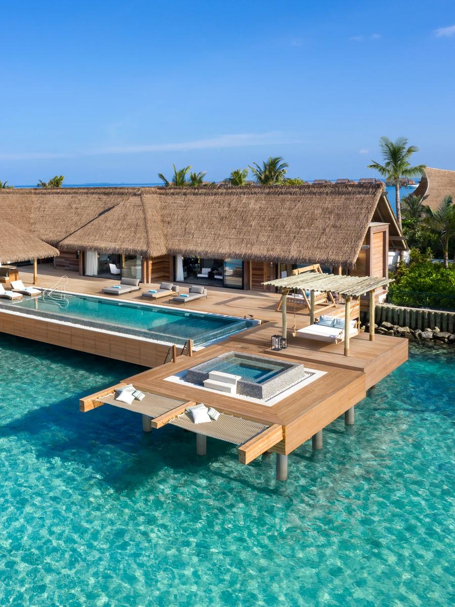 A reef-set villa at Waldorf Astoria Maldives Ithaafushi, with steps leading down to the lagoon