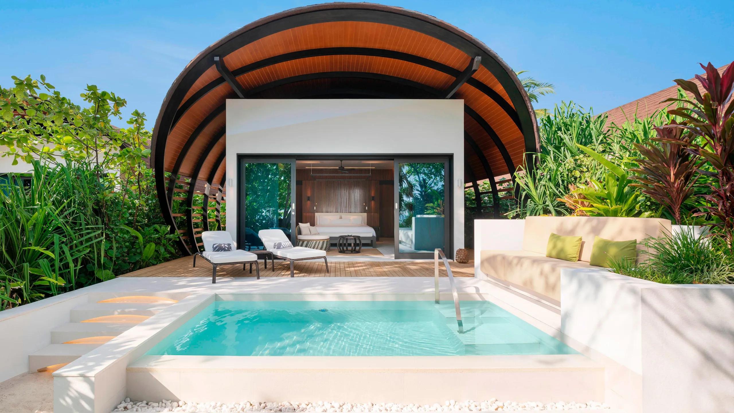 A Beach Villa Pool's private plunge pool and shell-roofed terrace, screened by garden greenery