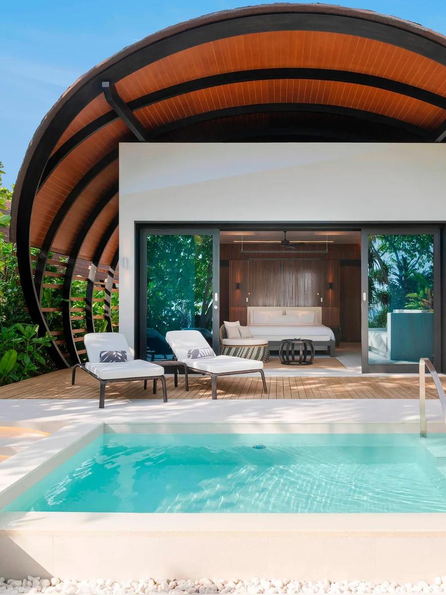 A Beach Villa Pool's private plunge pool and shell-roofed terrace, screened by garden greenery