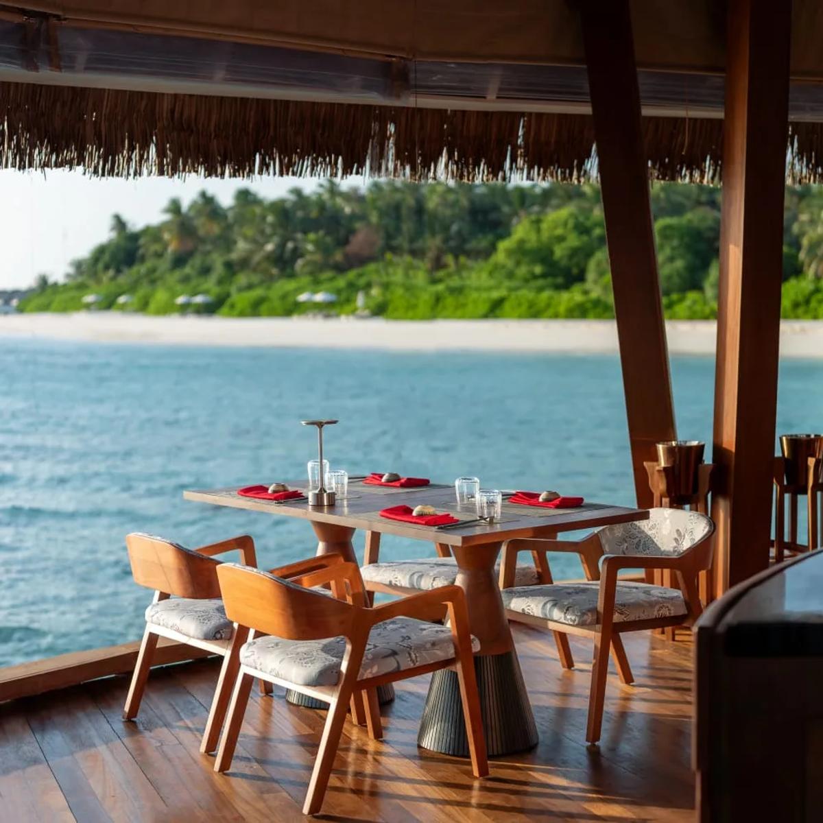 Overwater seating at FIRE restaurant, Anantara Kihavah Maldives Villas