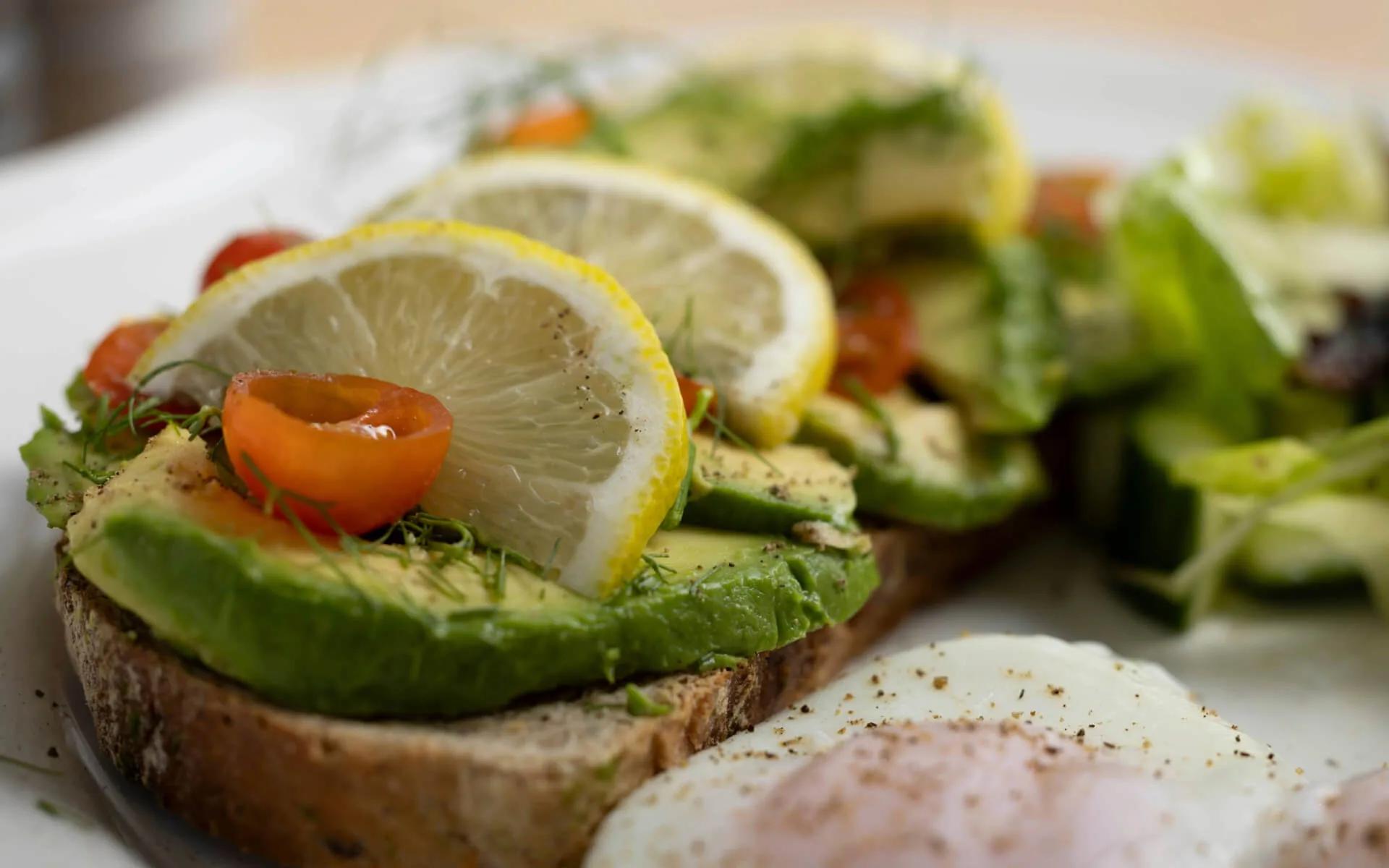 A breakfast plate of avocado toast and poached egg at Sea Spray