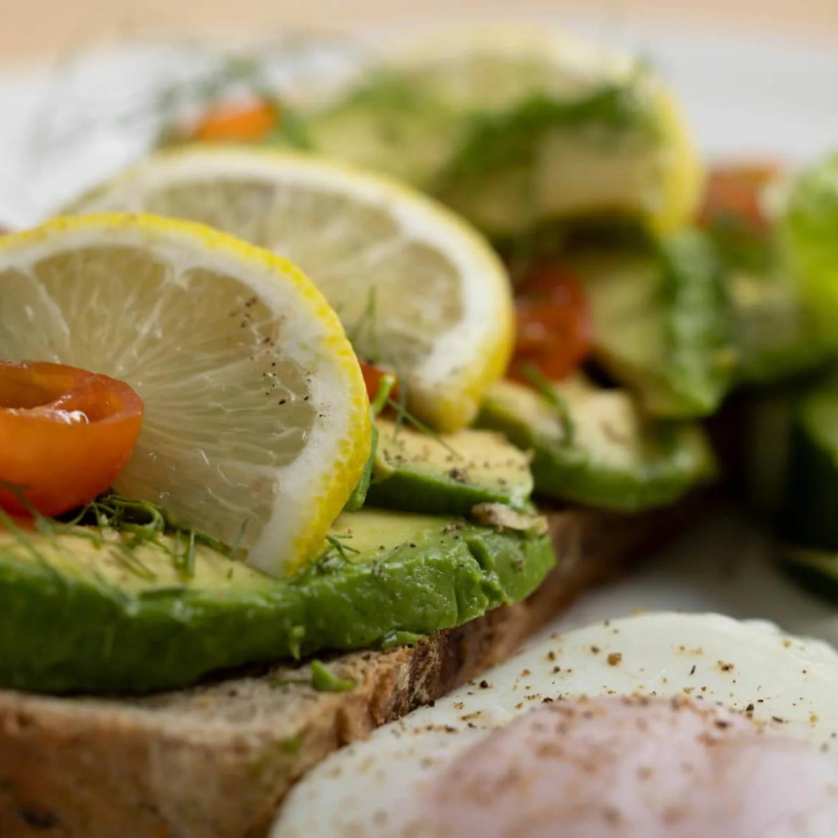 A breakfast plate of avocado toast and poached egg at Sea Spray