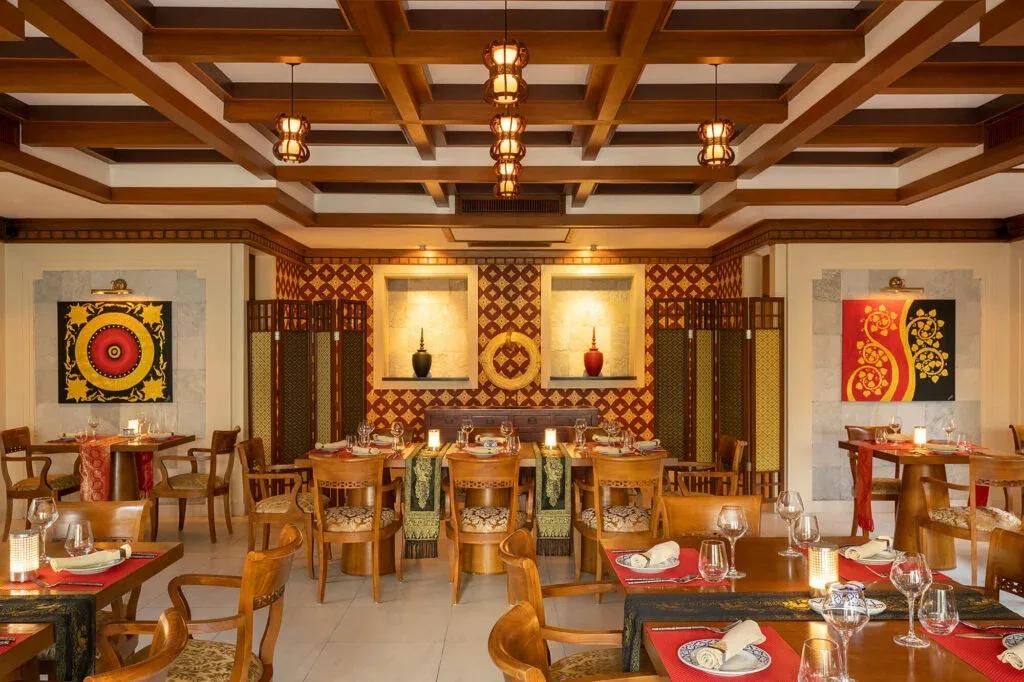 Khing Thai's dark-timbered dining room at Niva Kurumba