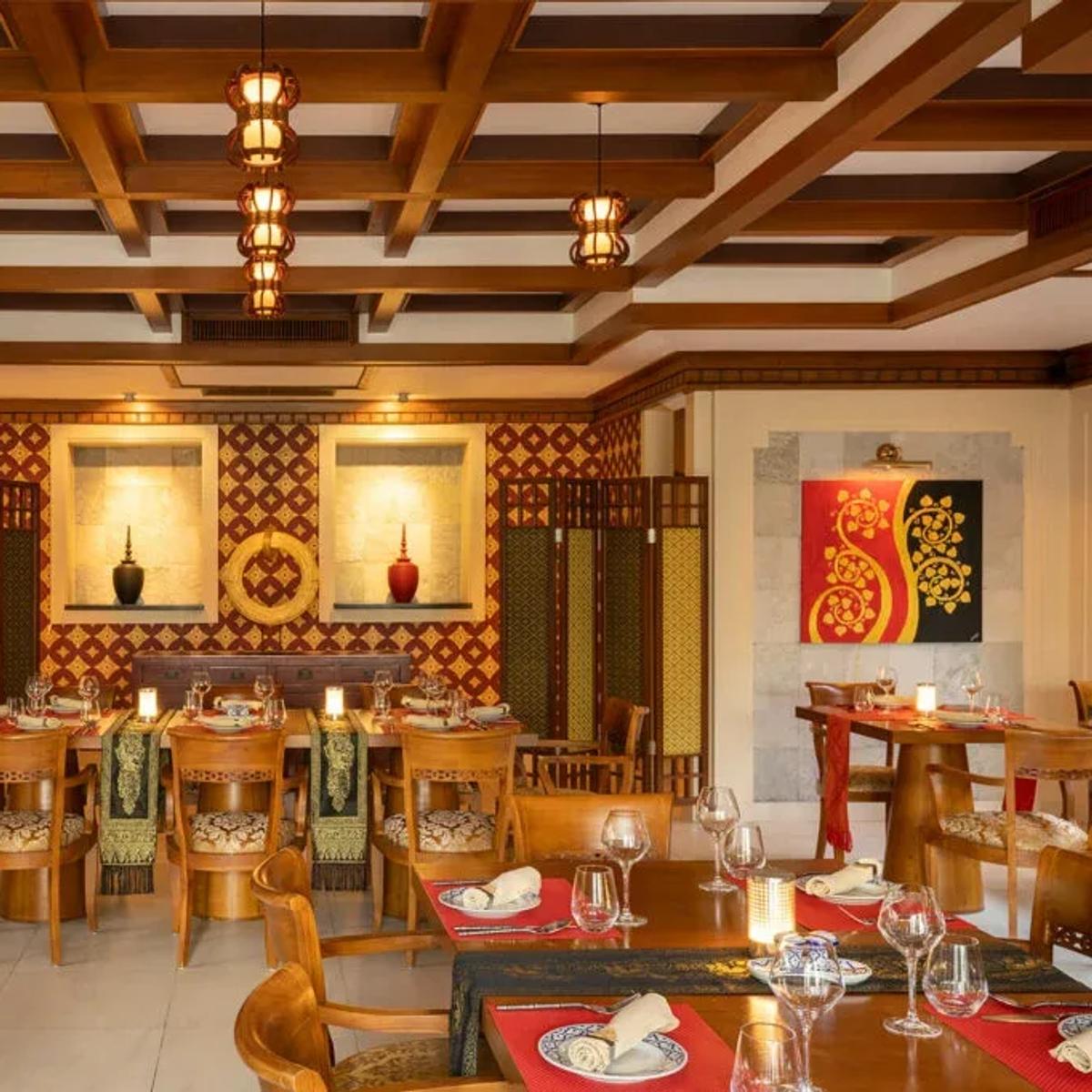 Khing Thai's dark-timbered dining room at Niva Kurumba