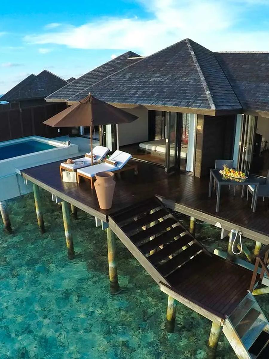 The overwater deck of a Sunset Water Suite at Lily Beach Resort & Spa