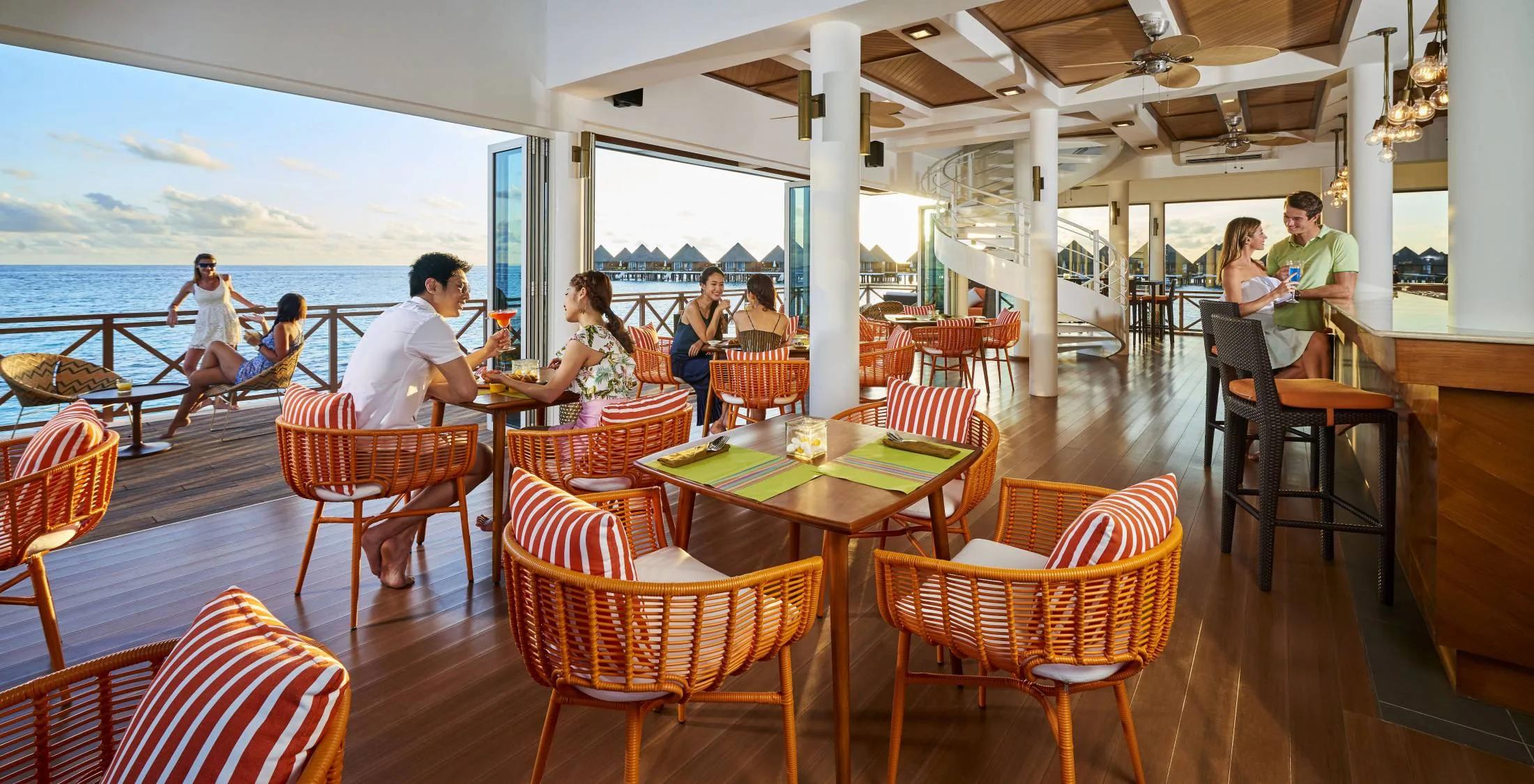 The interior dining room at Vista, Mercure Maldives Kooddoo Resort's overwater restaurant
