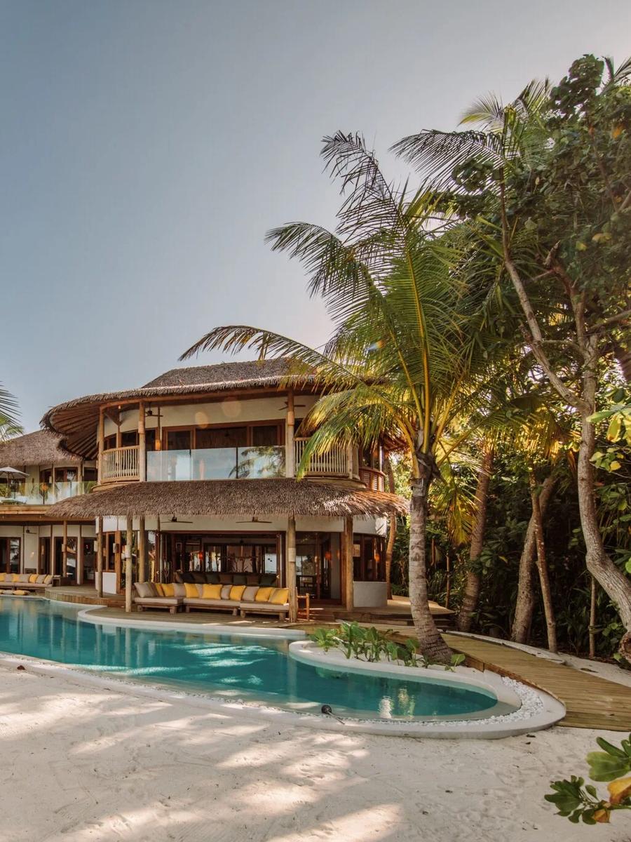 Villa 31, one of Soneva Fushi's two 5-Bedroom Residences — a multi-pavilion villa with its own slide into a long private pool