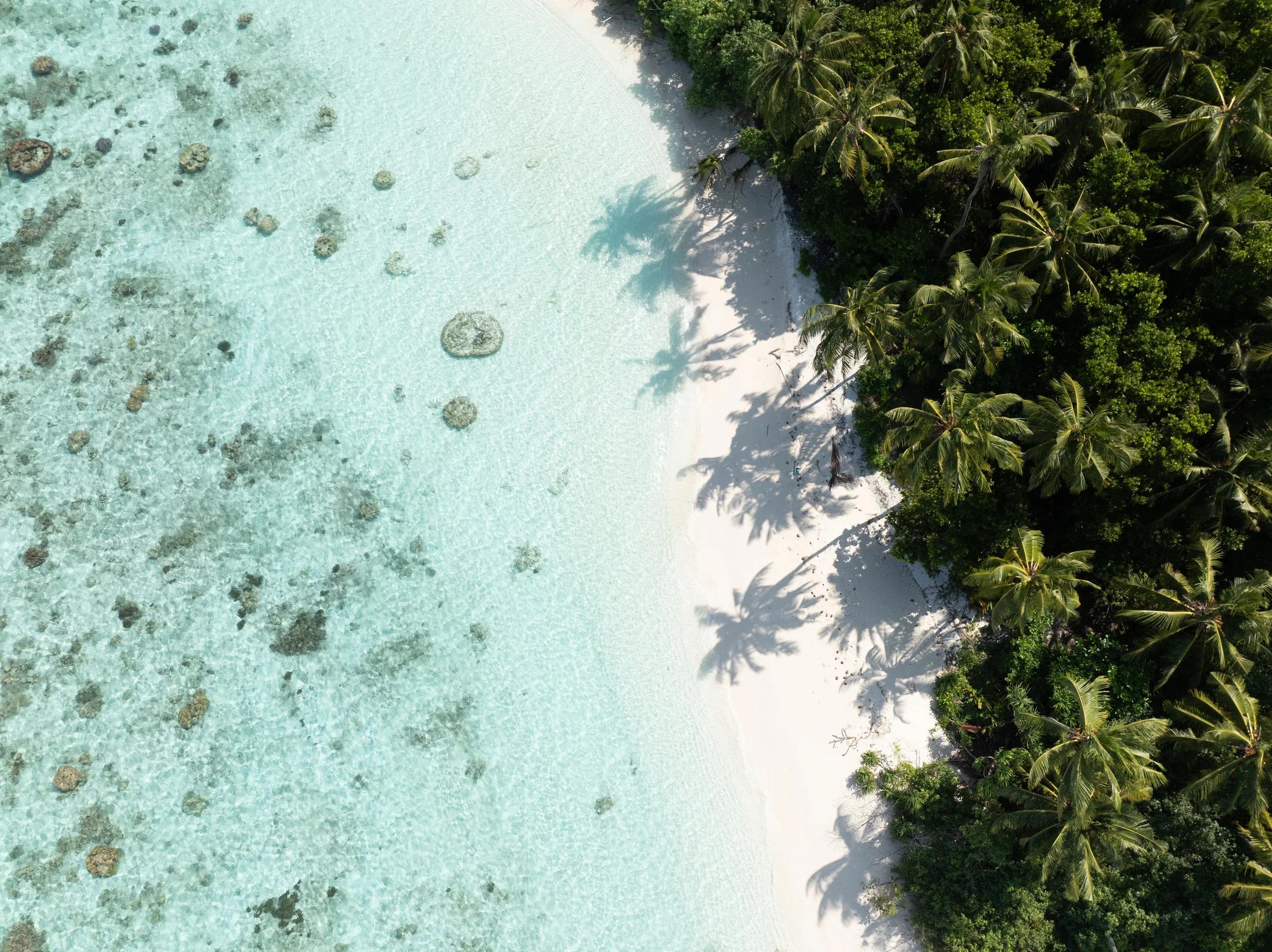 Aerial view of a local Maldivian island near Sun Siyam Olhuveli, visited on an island-exploration excursion