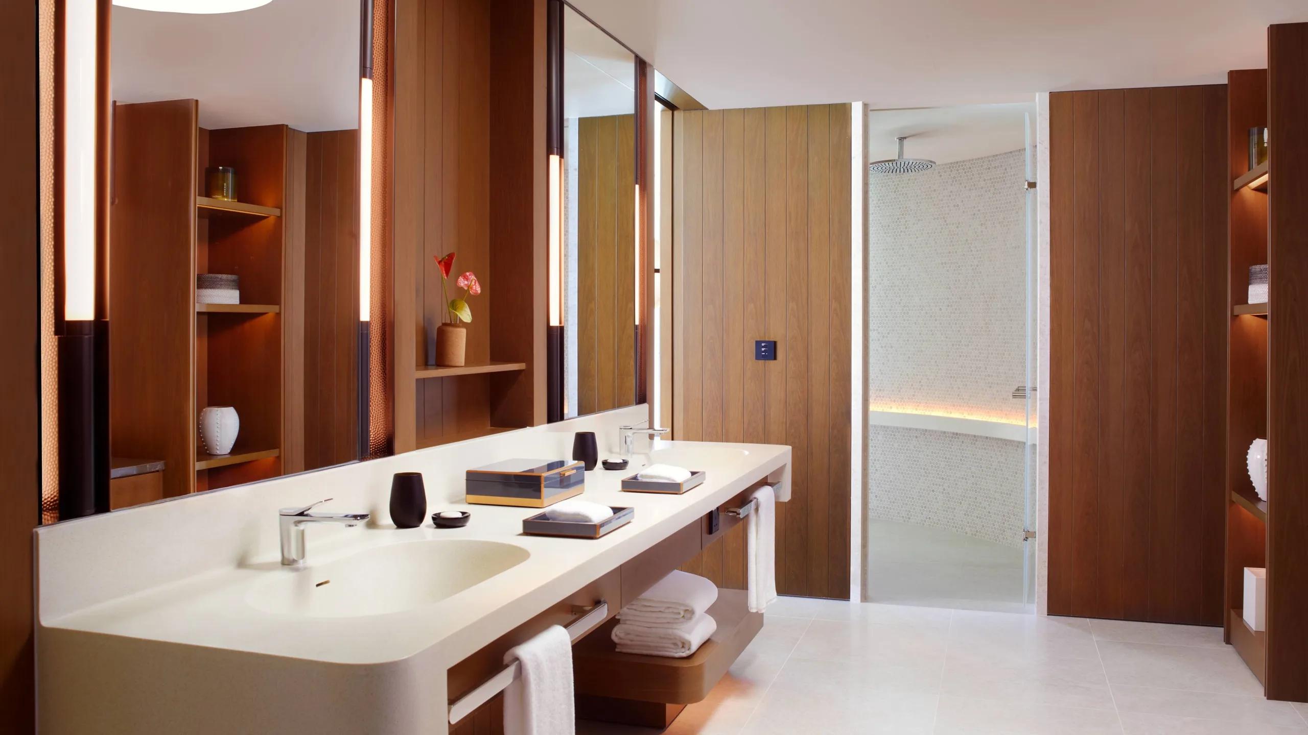 A villa's double-vanity bathroom and steam shower — stands in for the Sunset Beach Pool Villa (2 Bedroom), which has no dedicated photography on the official site