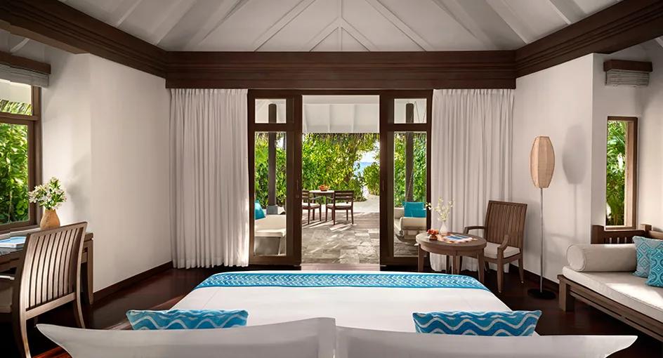 Bedroom interior of a Sunset Beach Villa at Anantara Dhigu