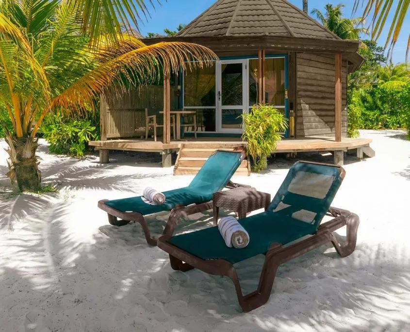 Sangu Premium Beach Villa bedroom with a corner window looking straight onto the ocean