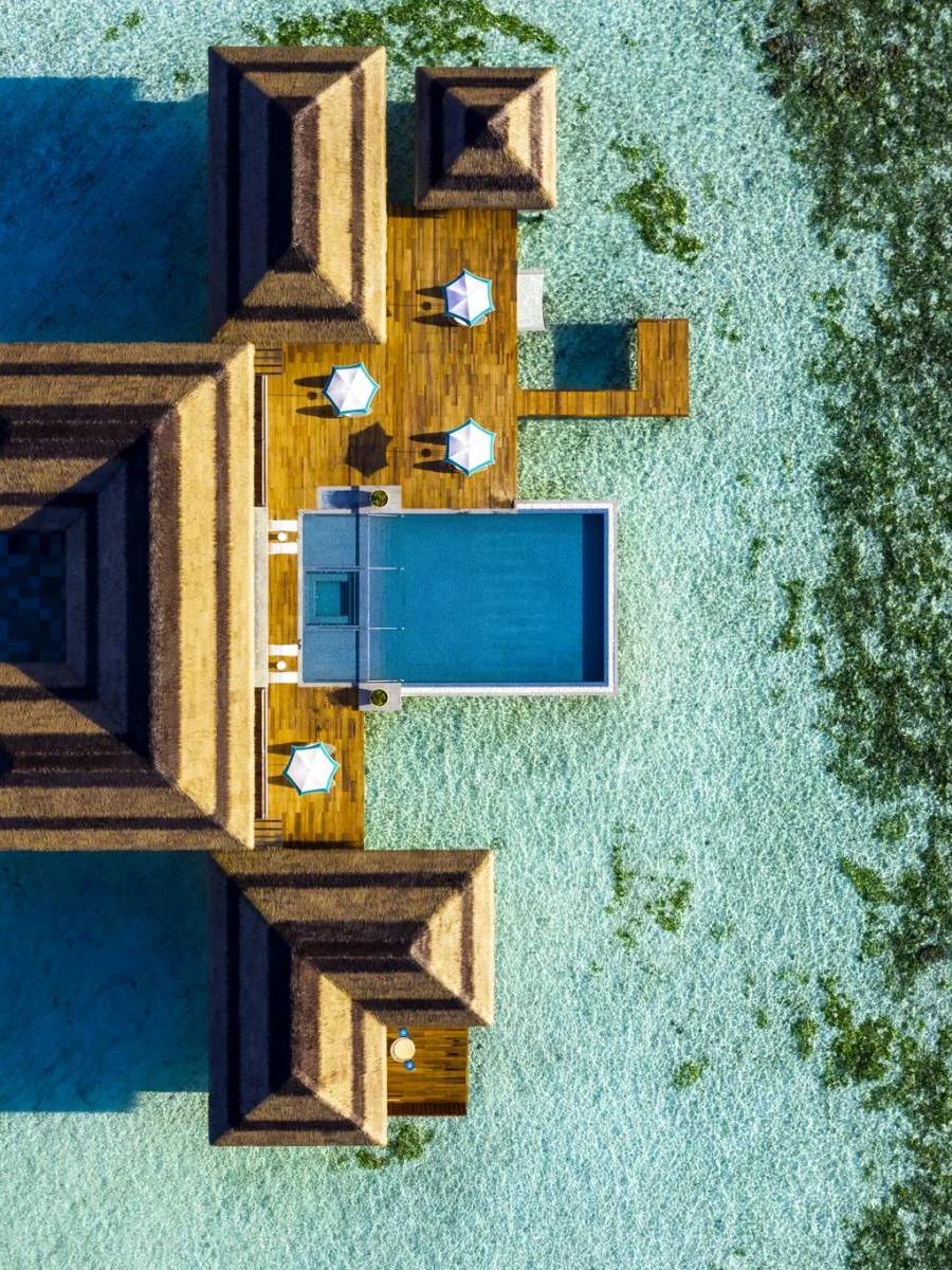 Aerial view of the Four Bedroom Ocean Pool Retreat and its overwater infinity pool