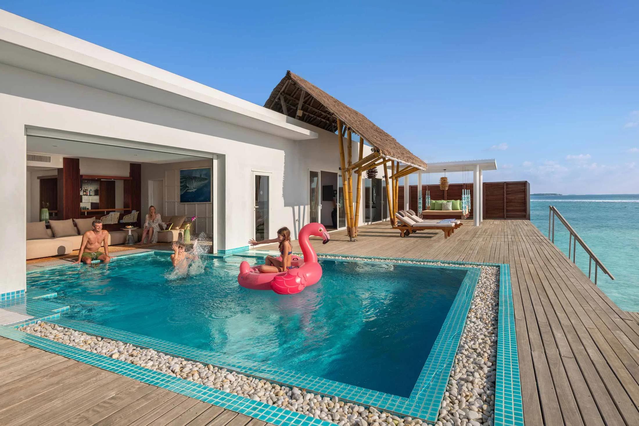 The Two Bedroom Presidential Ocean Villa with Pool's patio over the reef and 10x4 m pool