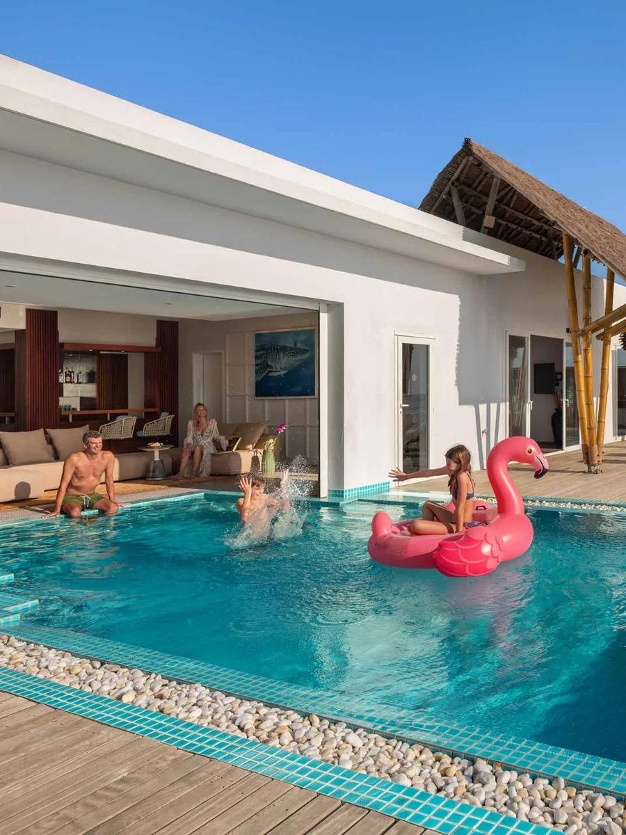 The Two Bedroom Presidential Ocean Villa with Pool's patio over the reef and 10x4 m pool
