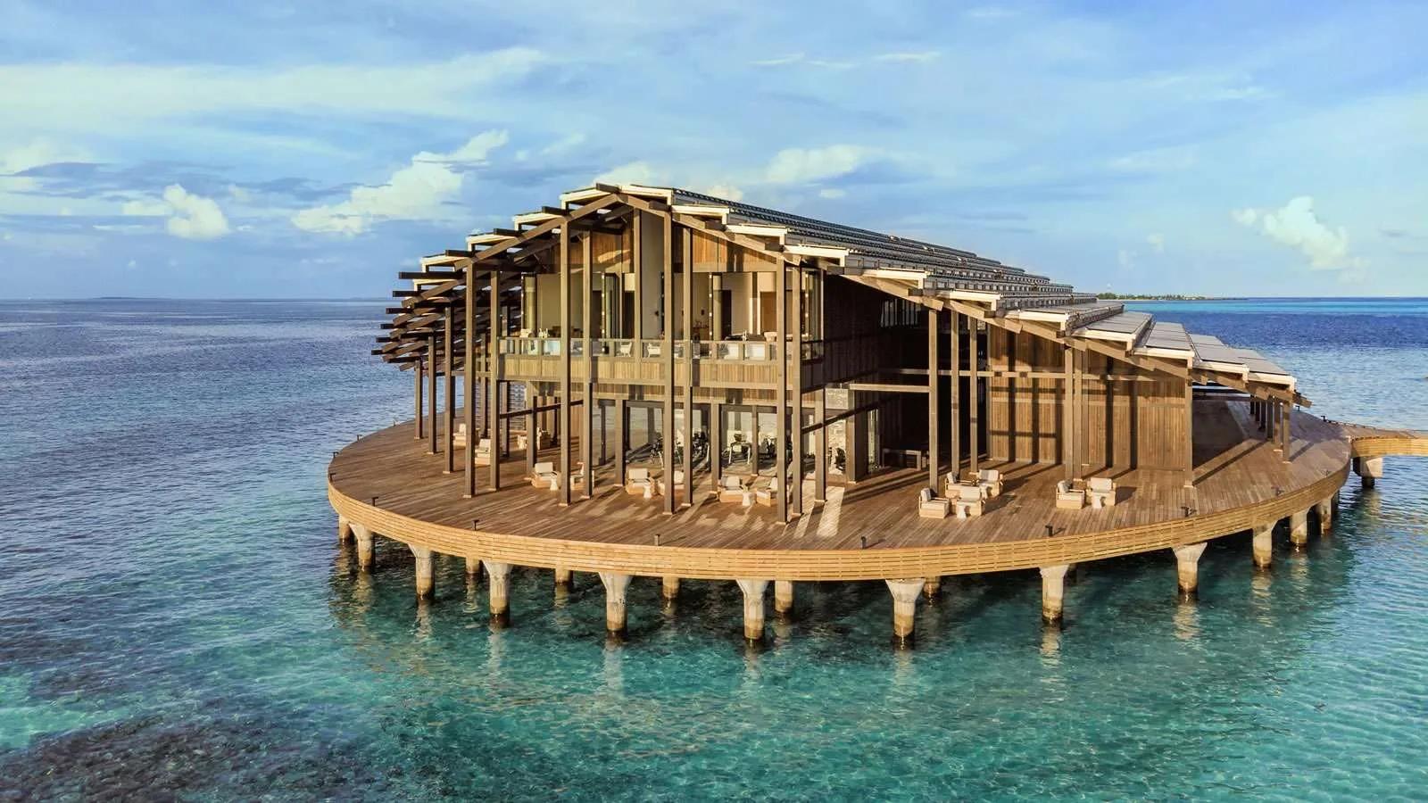 The Retreat, Kudadoo's two-storey main building, raised on stilts over the lagoon with its solar-panelled roof