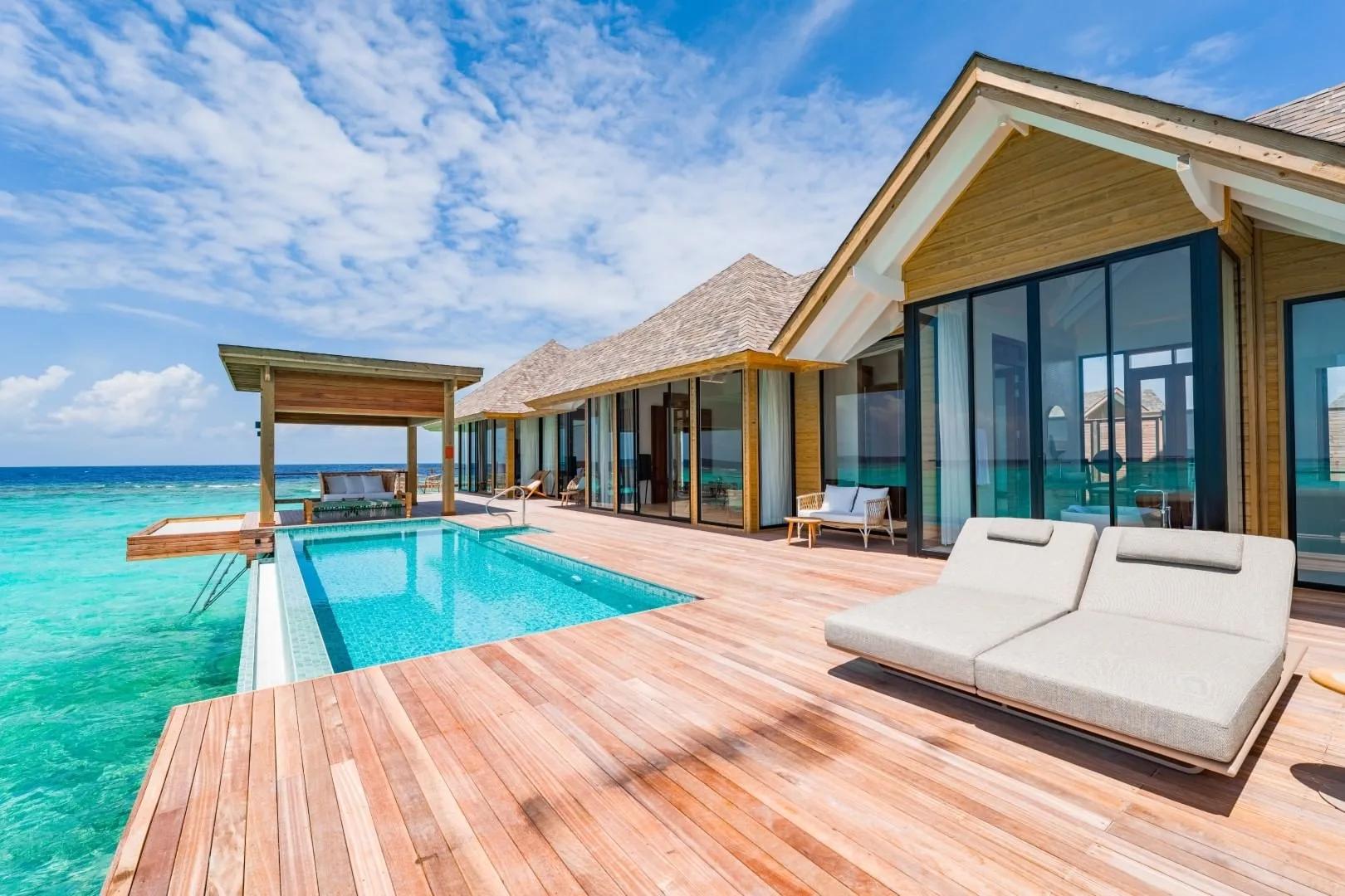 A 2-Bedroom Water Residence's deck and private pool, running the length of the building over the lagoon
