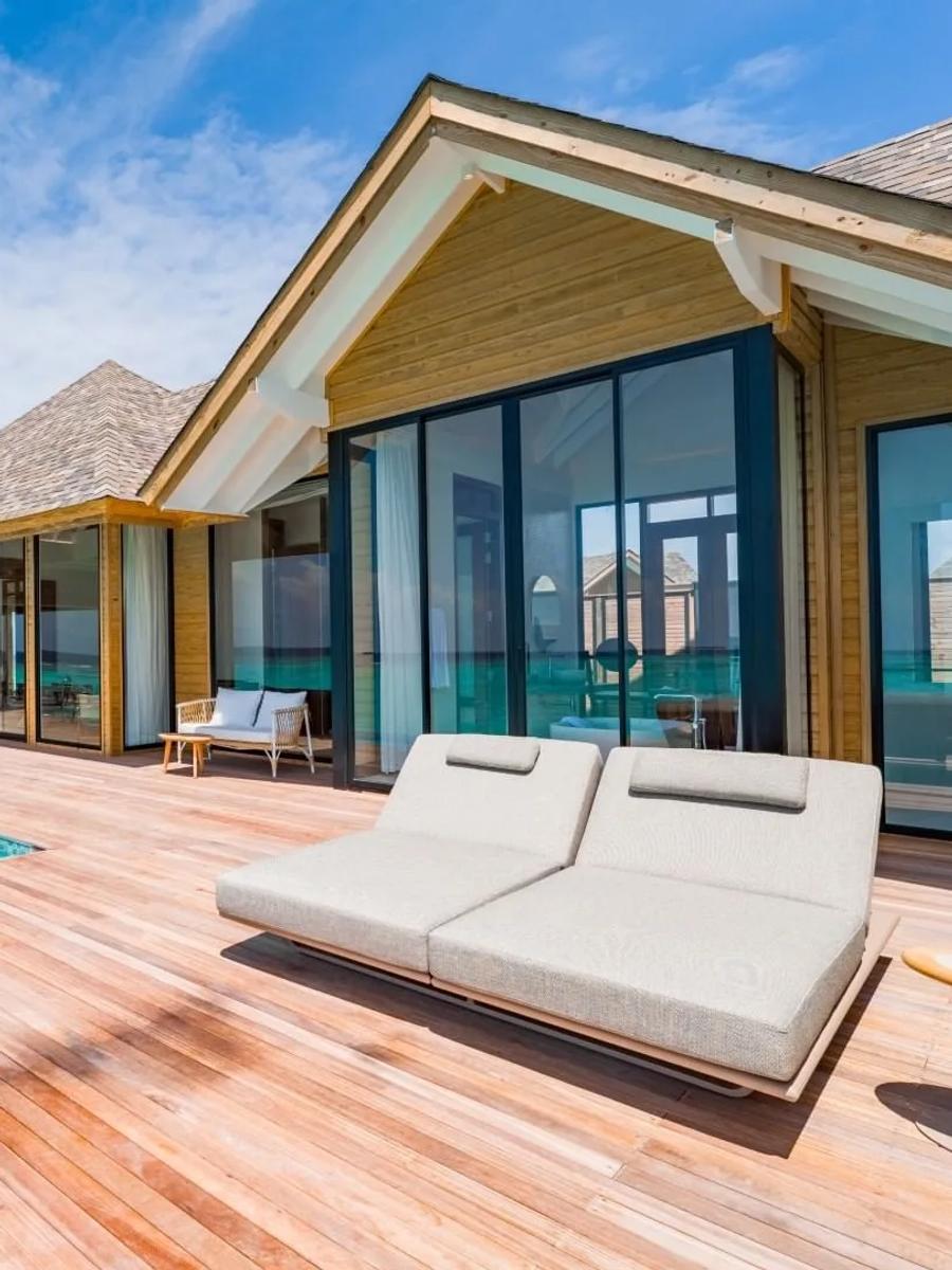 A 2-Bedroom Water Residence's deck and private pool, running the length of the building over the lagoon