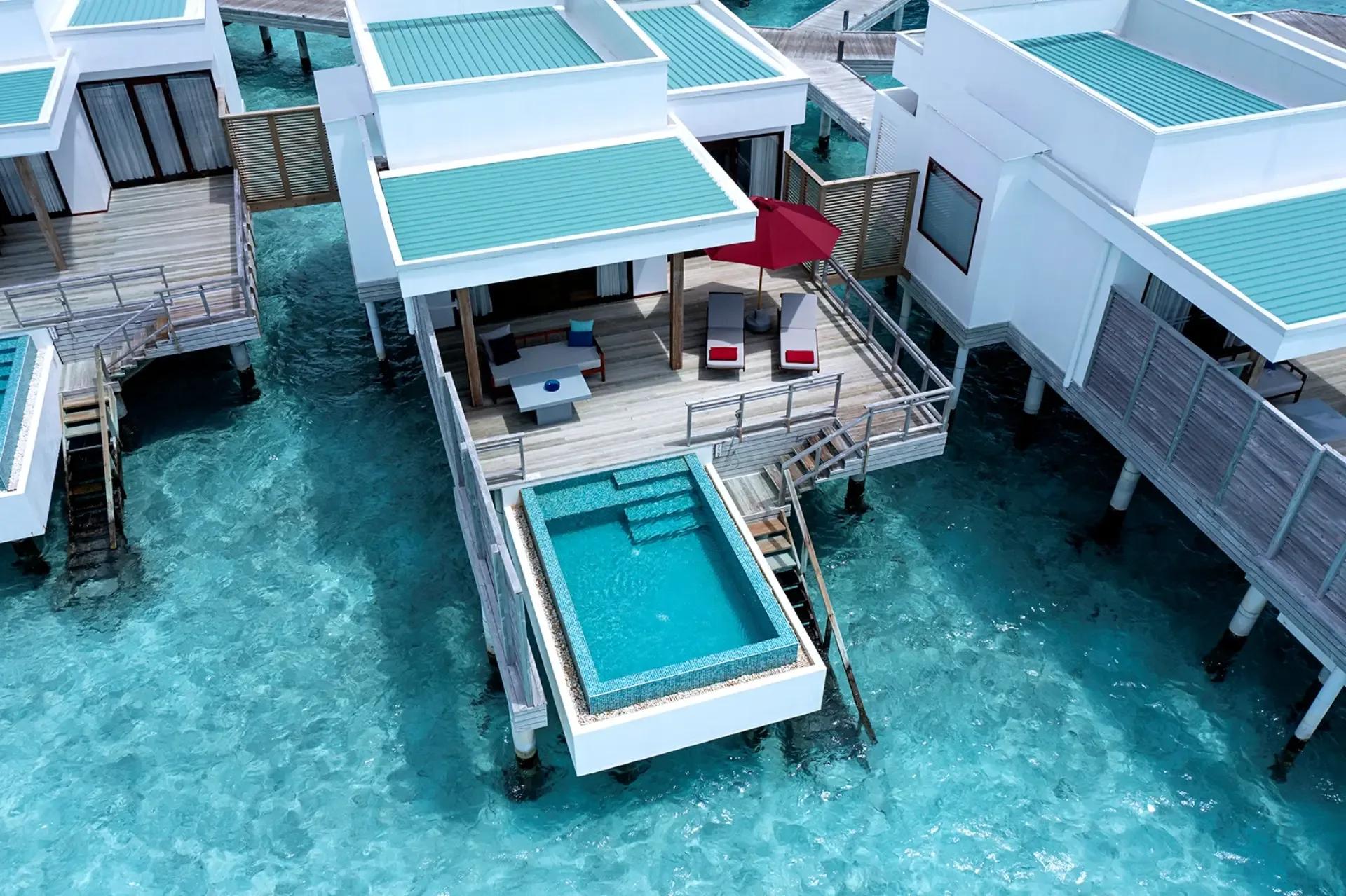 Aerial view of a Lagoon Villa with Pool, its private plunge pool set over the turquoise lagoon