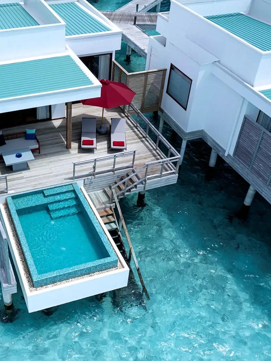 Aerial view of a Lagoon Villa with Pool, its private plunge pool set over the turquoise lagoon