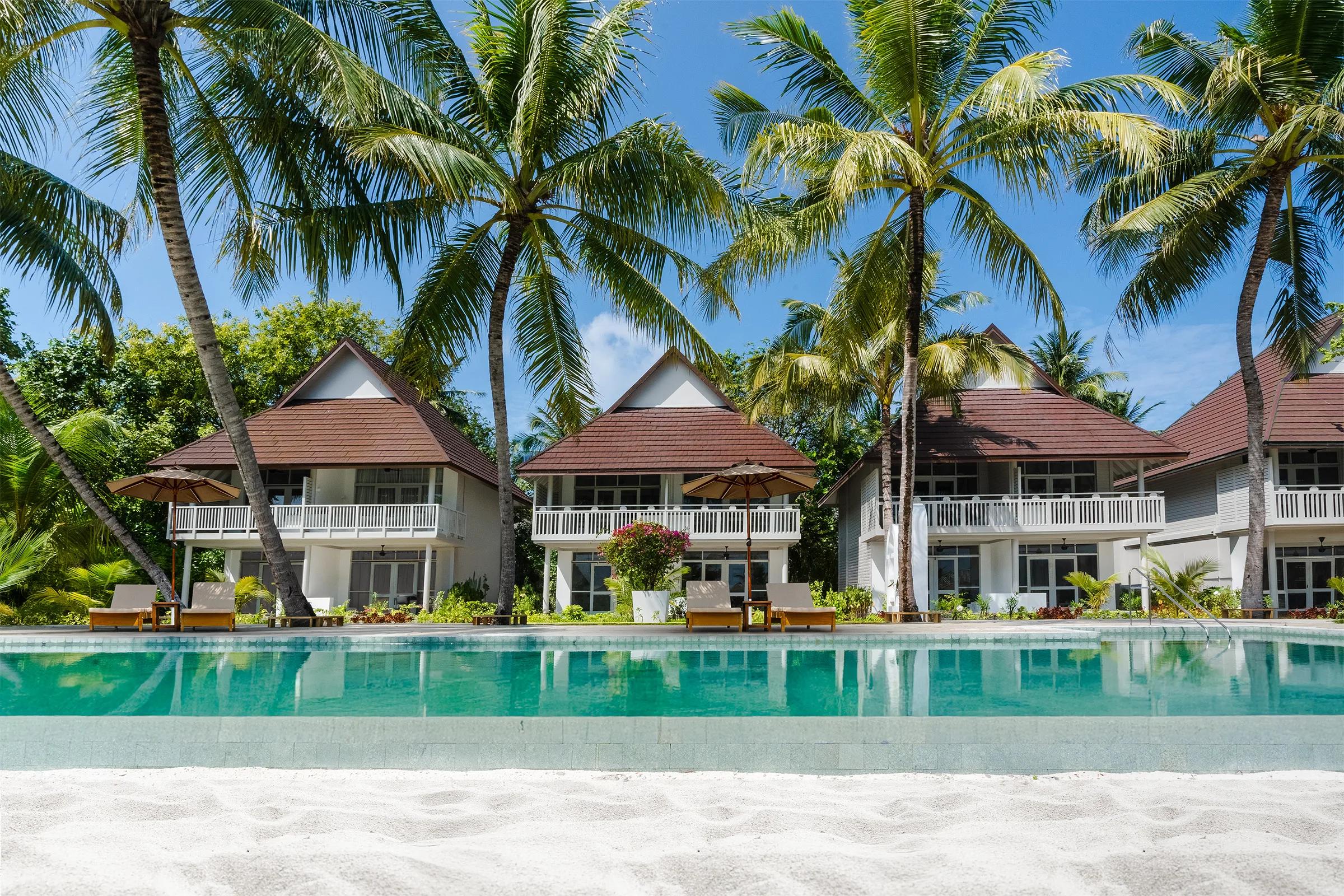 Exterior of a Beach Pavilion at Sun Siyam Olhuveli, set among palm trees on Main Island