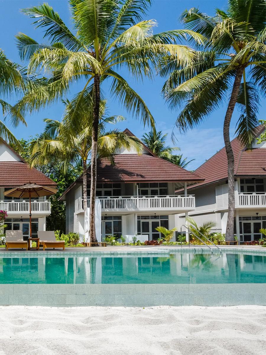 Exterior of a Beach Pavilion at Sun Siyam Olhuveli, set among palm trees on Main Island