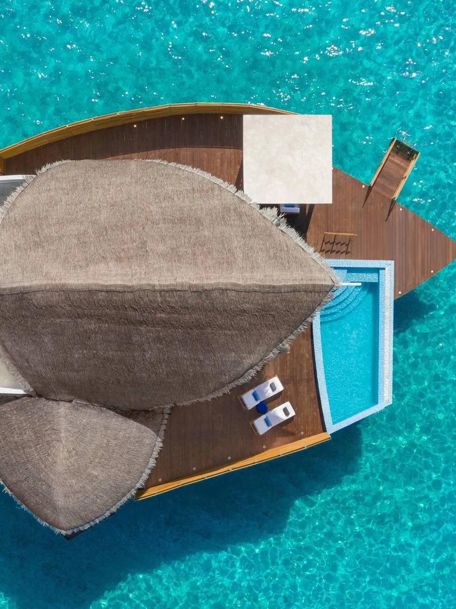 Top-down aerial view of a Duplex Overwater Pool Villa and its private pool, set in the turquoise lagoon