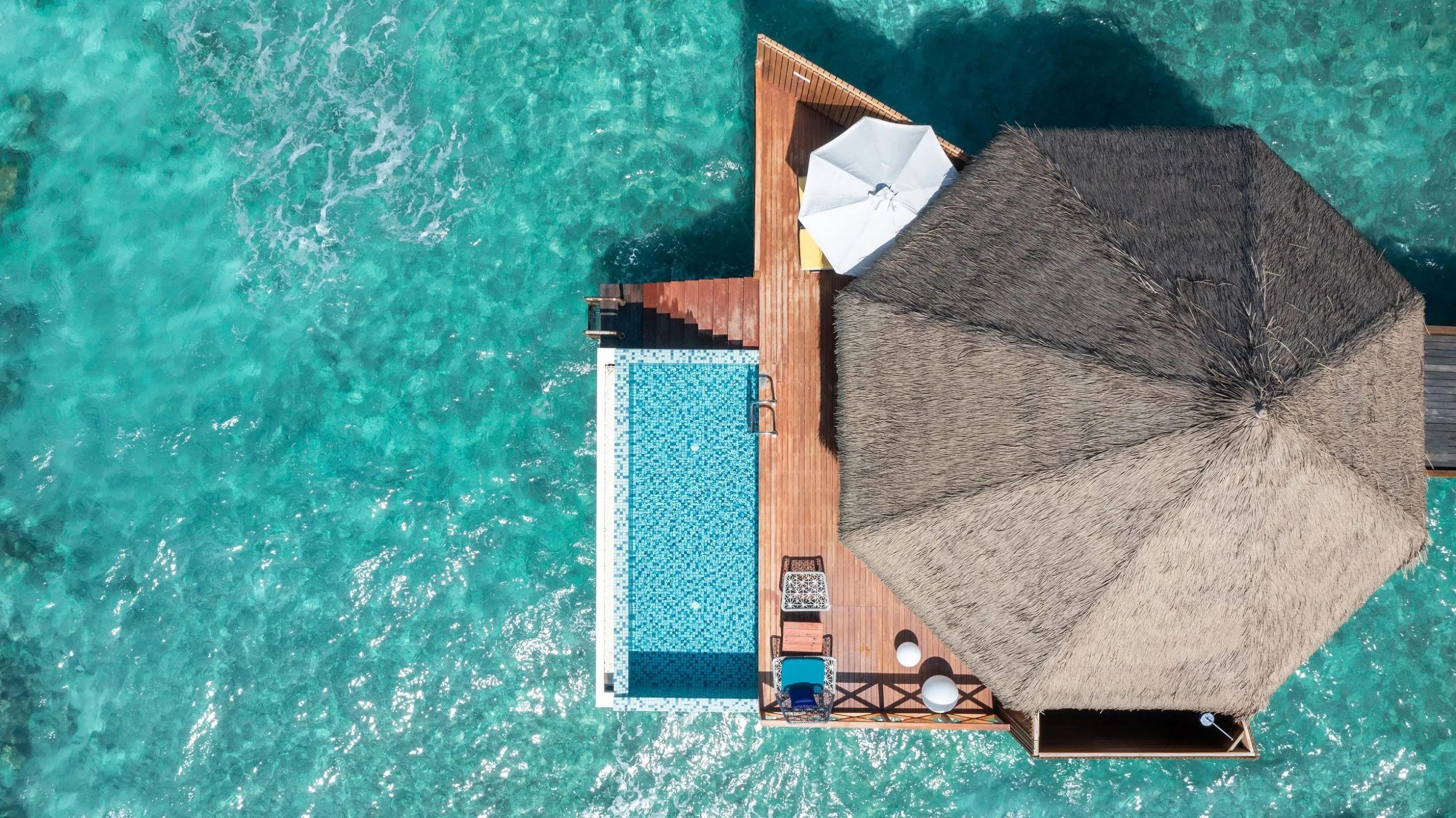 An aerial view of the private pool and deck of an overwater villa at Mercure Maldives Kooddoo Resort, Gaafu Alifu Atoll