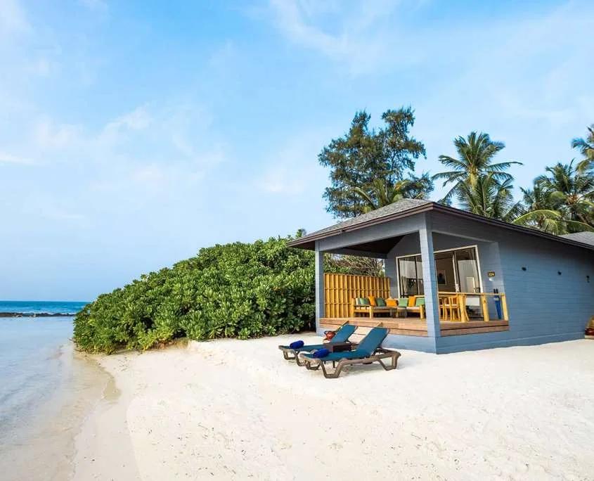 Aerial view of Two Bedroom Beach Villas in a row along the beach, each with its own gabled roof