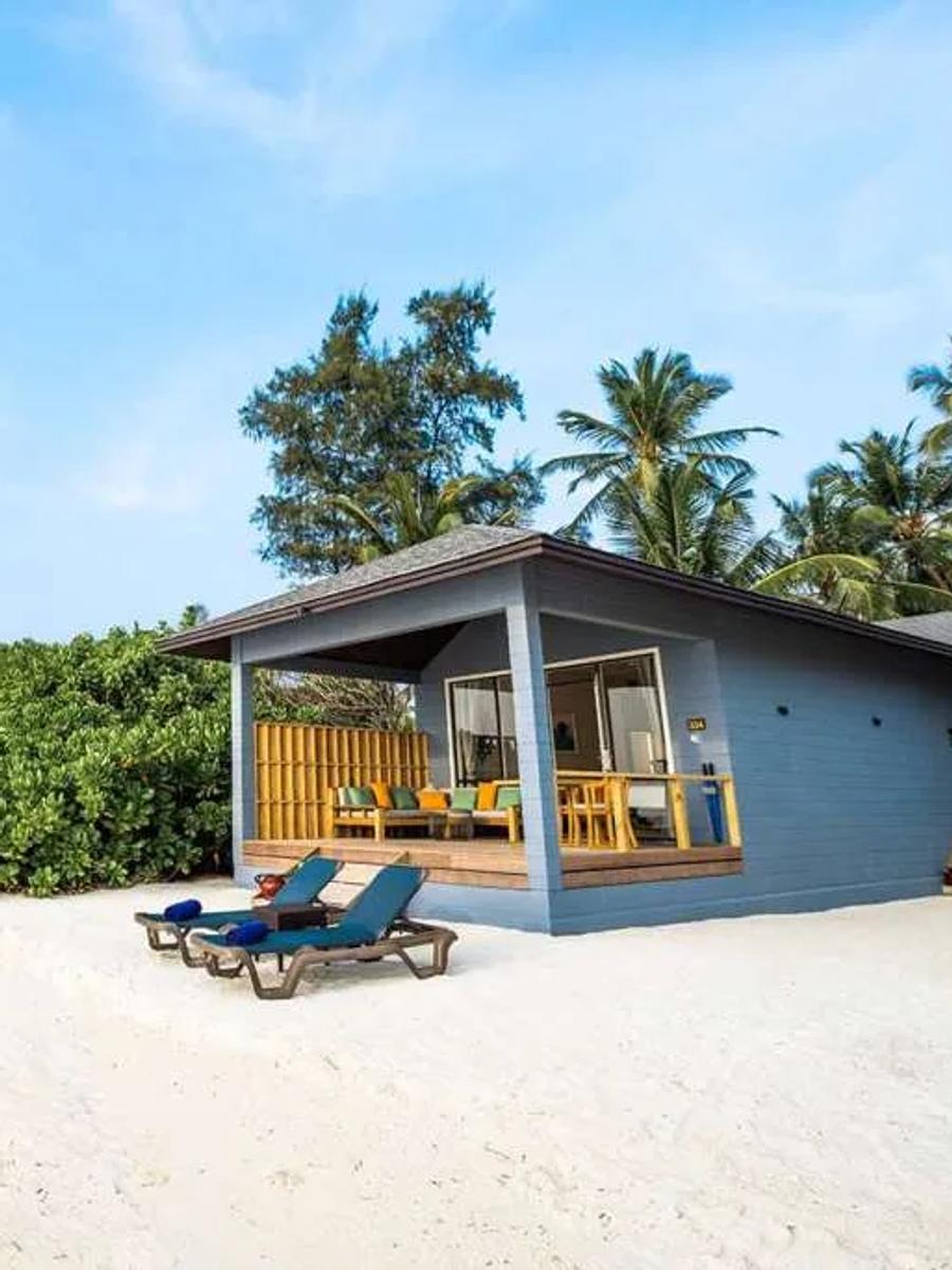 Aerial view of Two Bedroom Beach Villas in a row along the beach, each with its own gabled roof