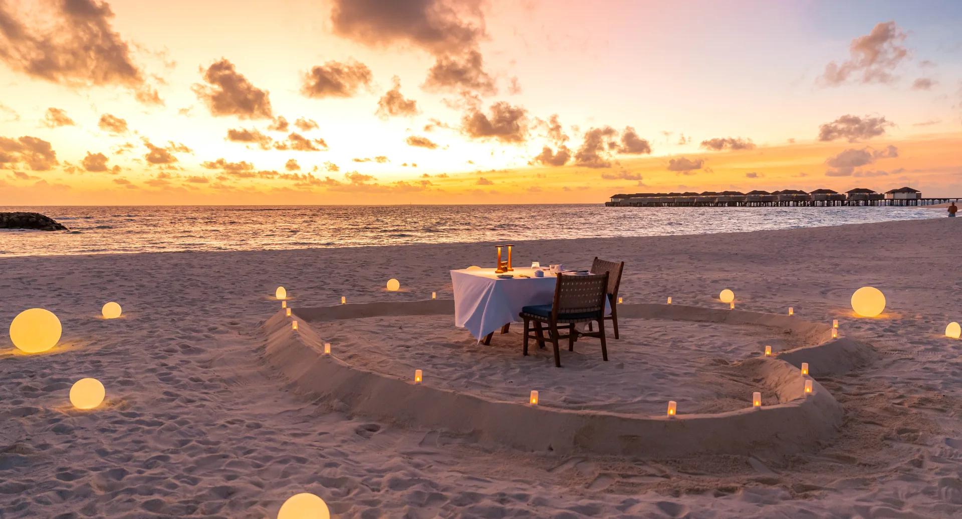 A private heart-shaped beach dinner set up by Adrift, Avani+ Fares Maldives Resort's private dining team