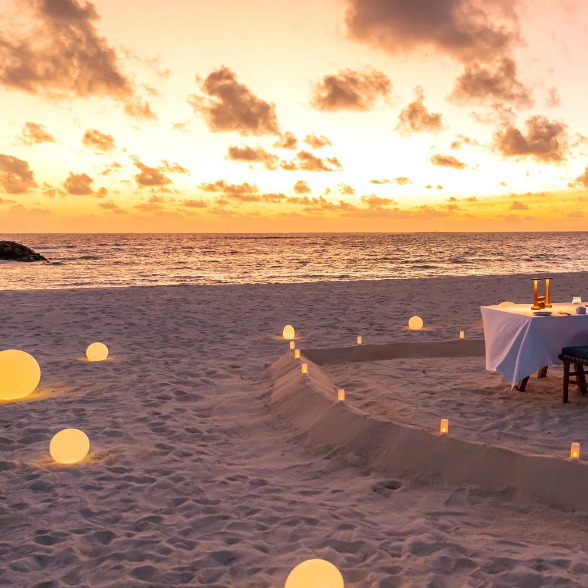 A private heart-shaped beach dinner set up by Adrift — Avani+ Fares has not published a dedicated photograph of Smugglers Shack; this beachfront dining scene stands in