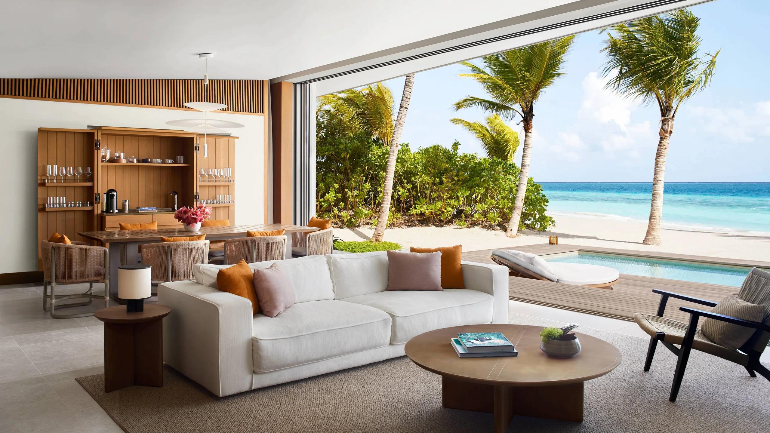 A Beach Pool Villa's living area opening onto the sand and a private pool — stands in for the Ocean & Beach Pool Villa, which has no dedicated photography on the official site