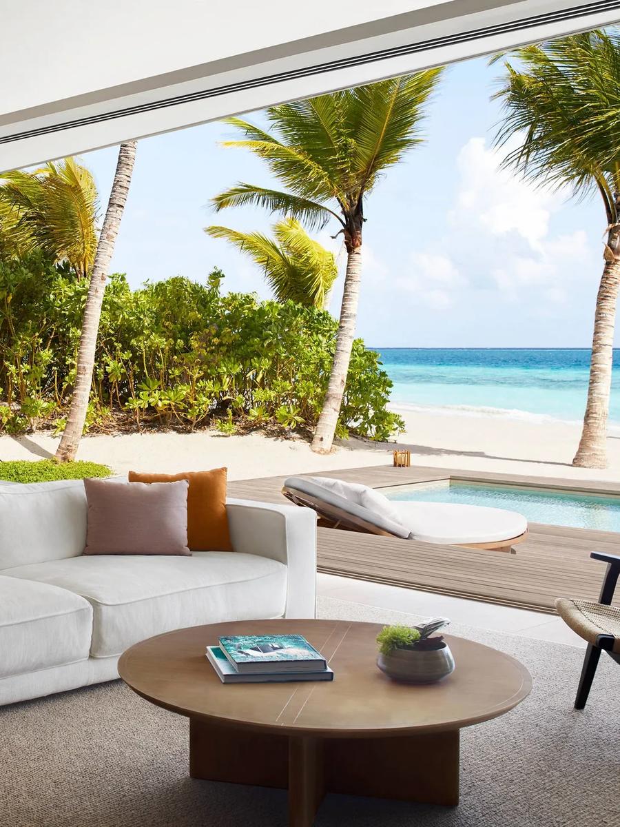A Beach Pool Villa's living area opening onto the sand and a private pool — stands in for the Ocean & Beach Pool Villa, which has no dedicated photography on the official site