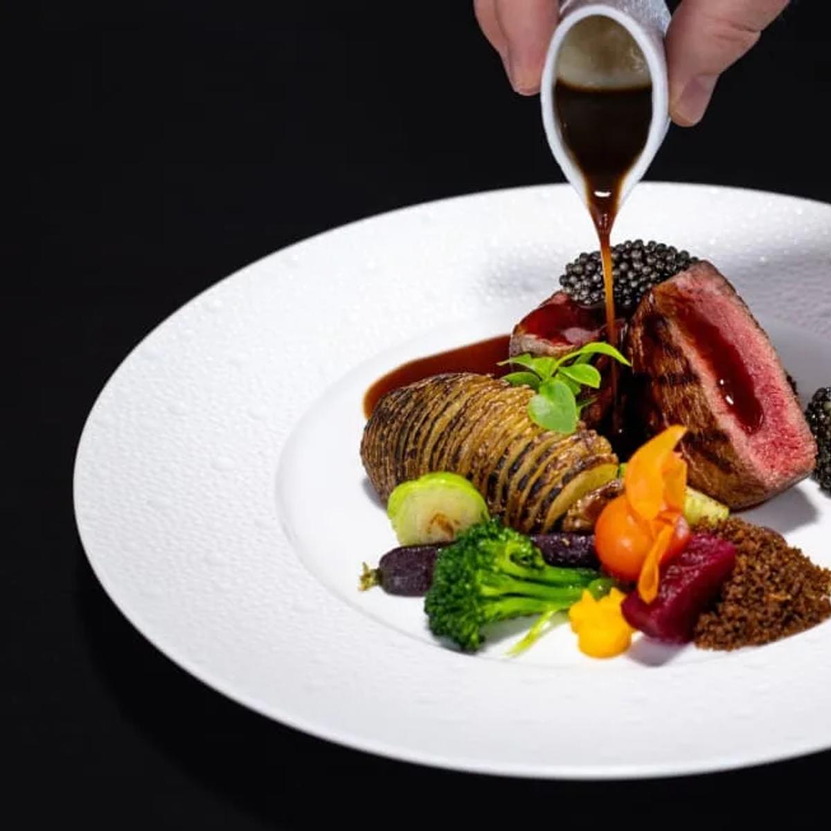 A plated course served at SEA, the underwater restaurant at Anantara Kihavah Maldives Villas