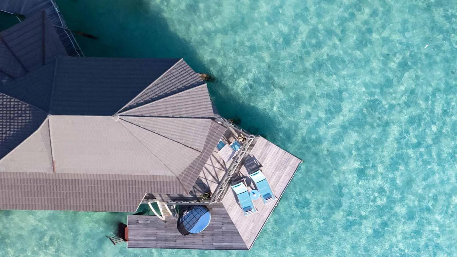 Bird's-eye view of the Sangu Water Villa Honeymoon Suite's overwater deck at the end of the jetty