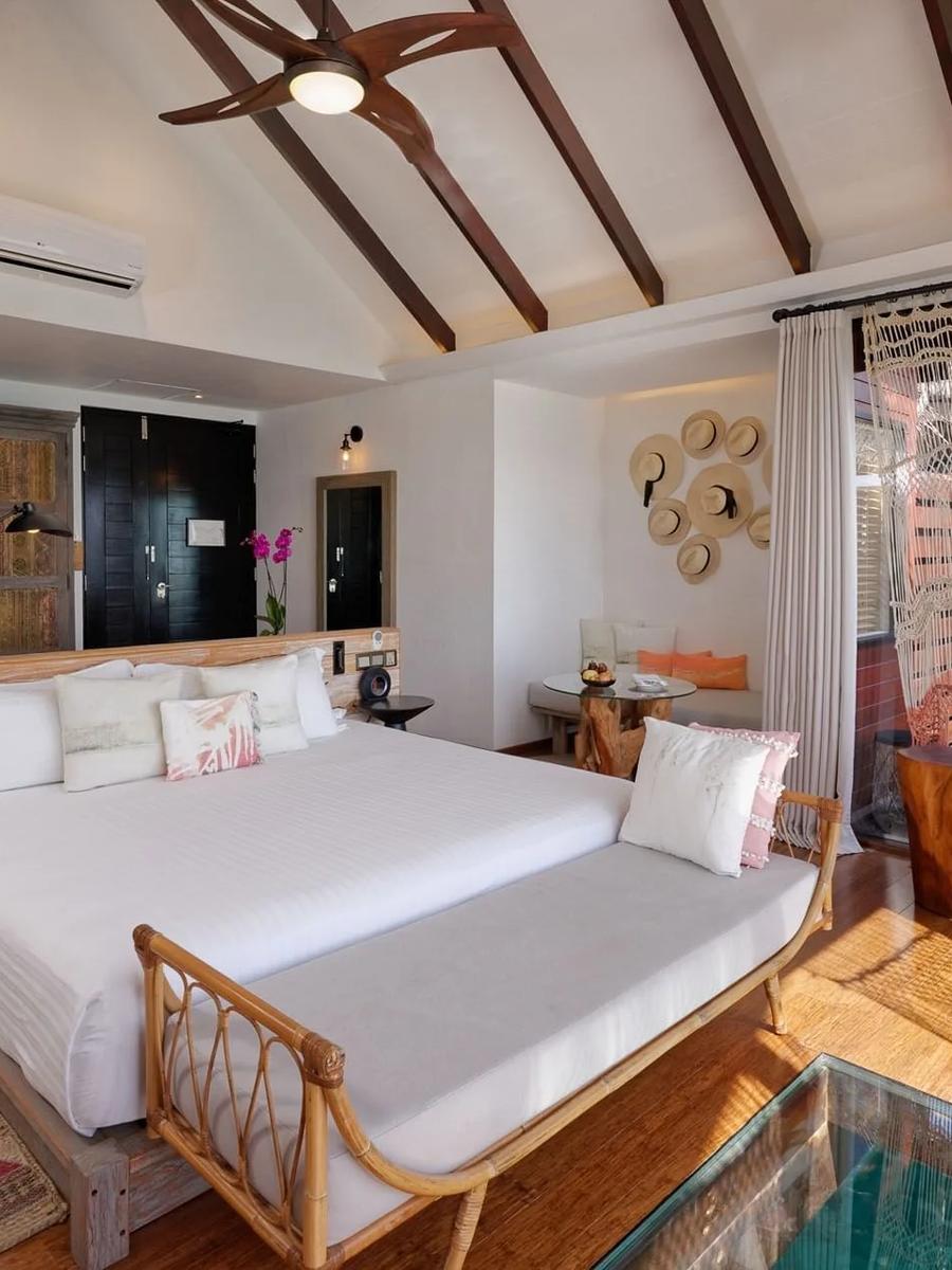 The bedroom of an Ocean Water Villa
