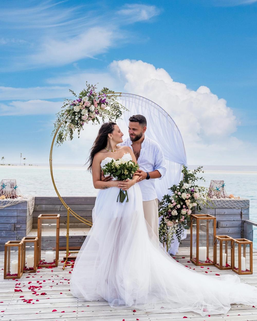 A couple during a beach ceremony in the Maldives