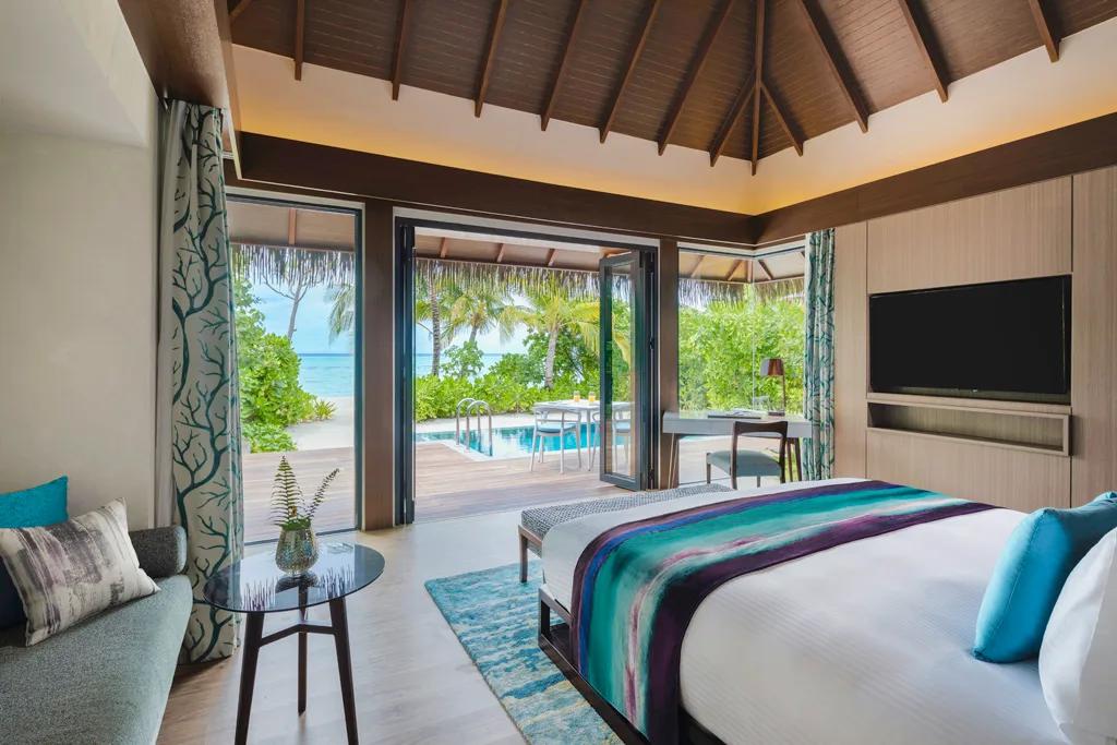 The private pool and terrace of a Beach Pool Villa surrounded by vegetation
