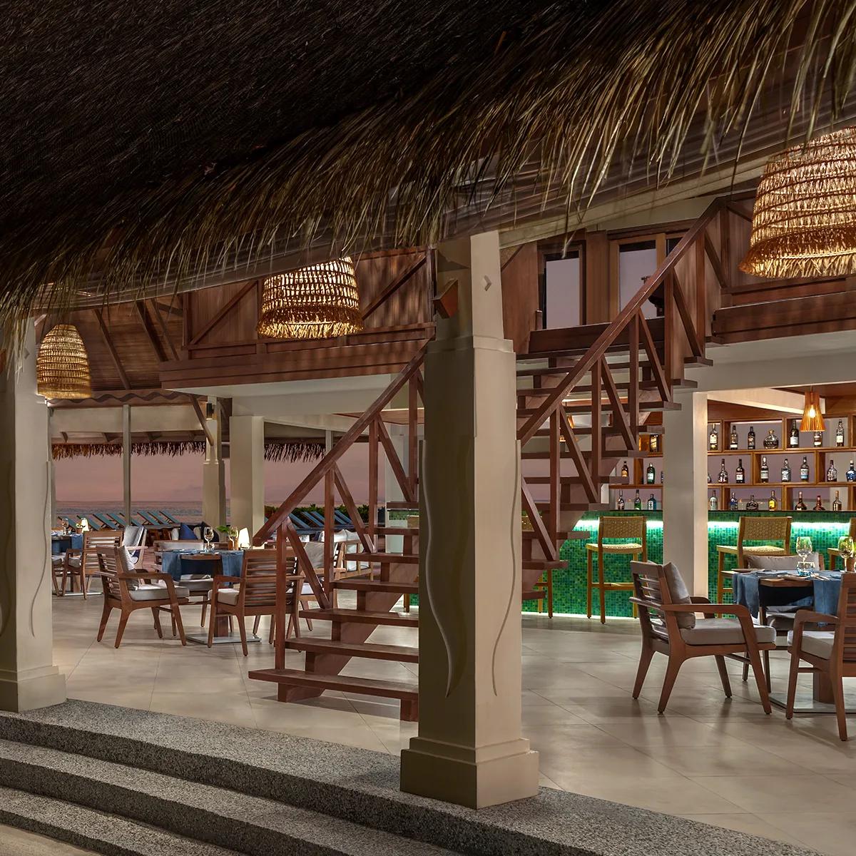Poolside interior seating at Aqua, Anantara Dhigu's Italian restaurant