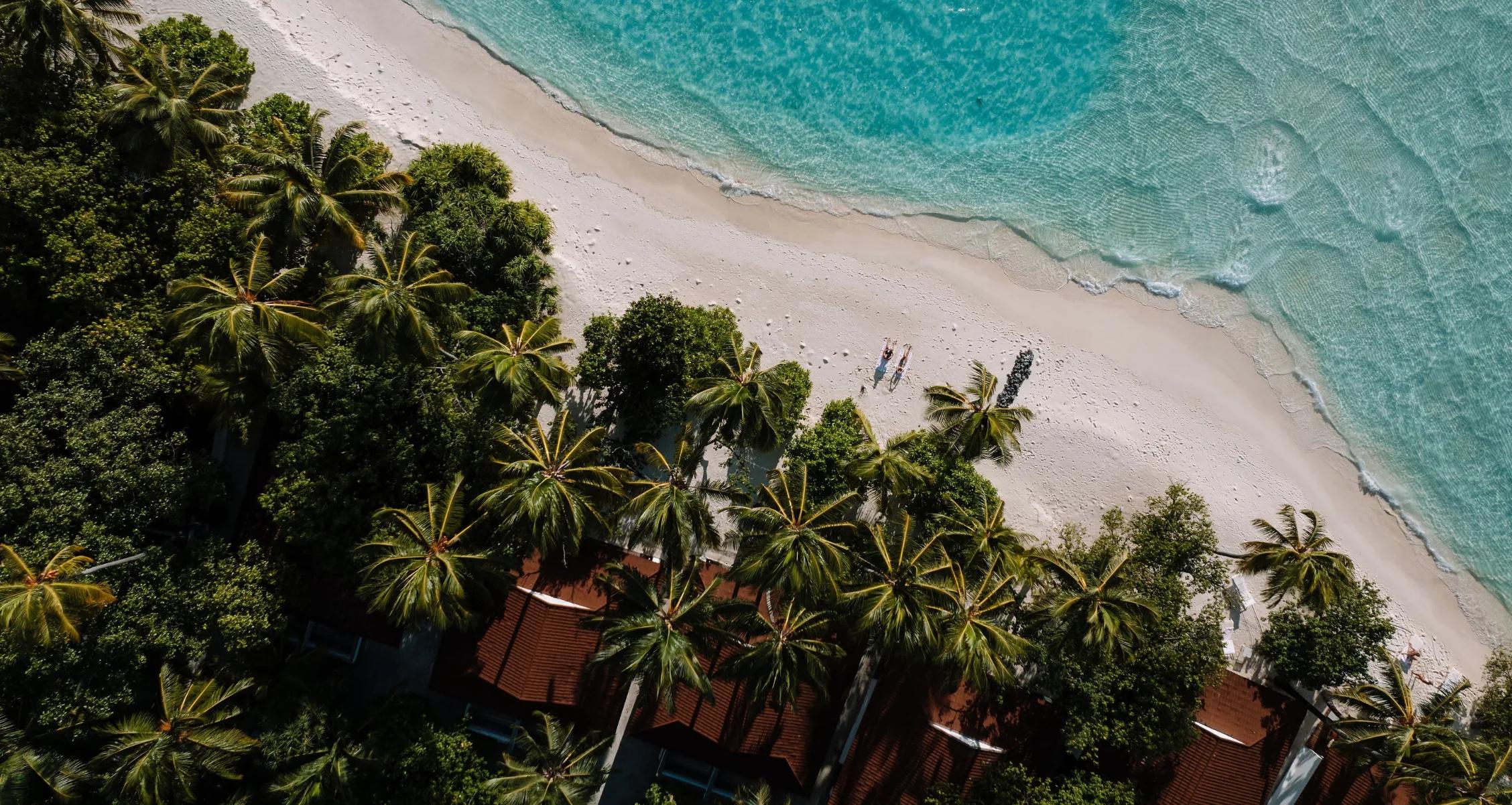 Aerial view of the beach along the Lagoon Villas at Diamonds Athuruga