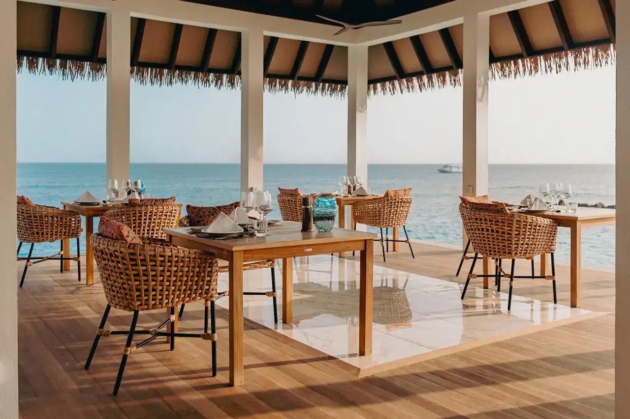 Thaana's open-air terrace dining room, set for an evening meal