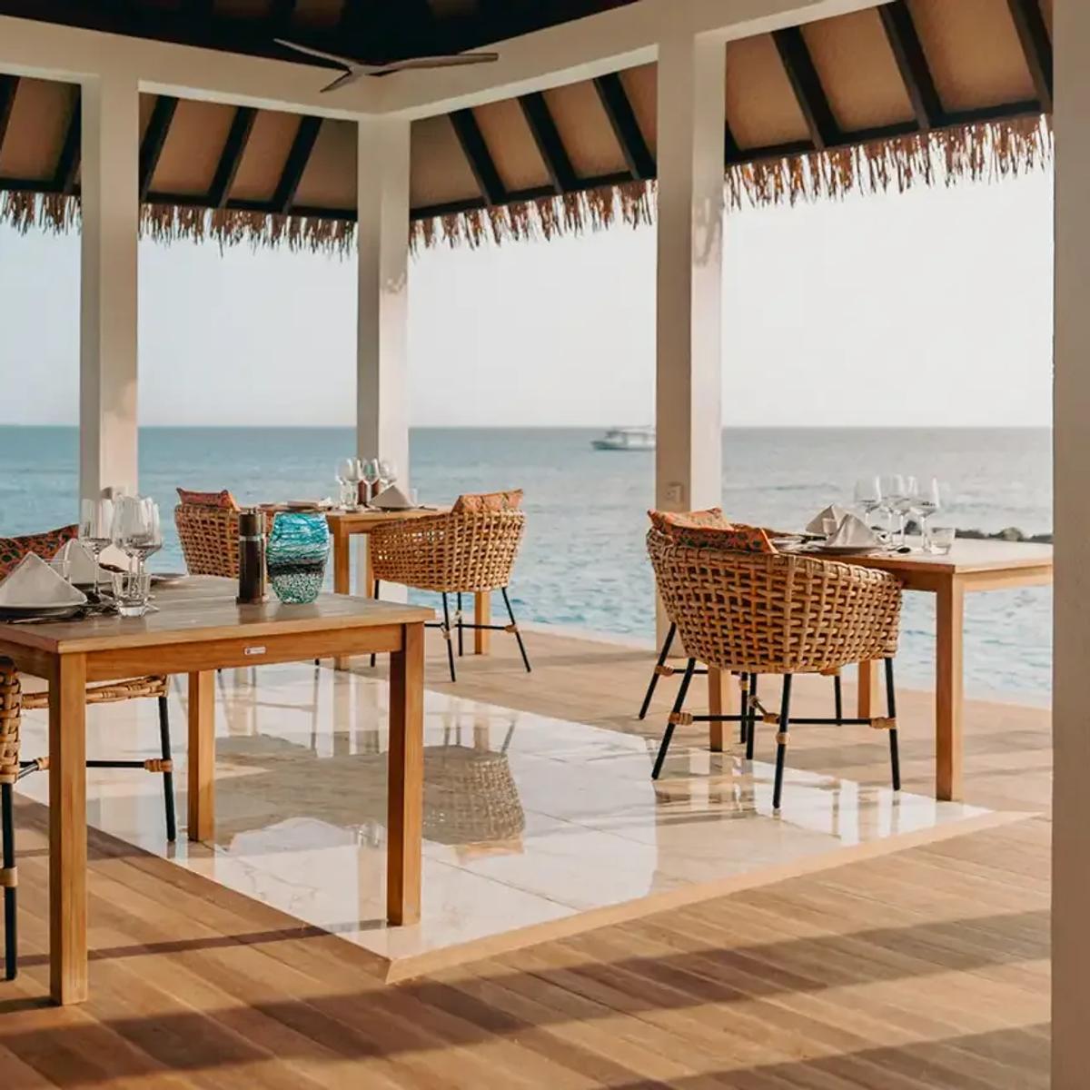 Thaana's open-air terrace dining room, set for an evening meal