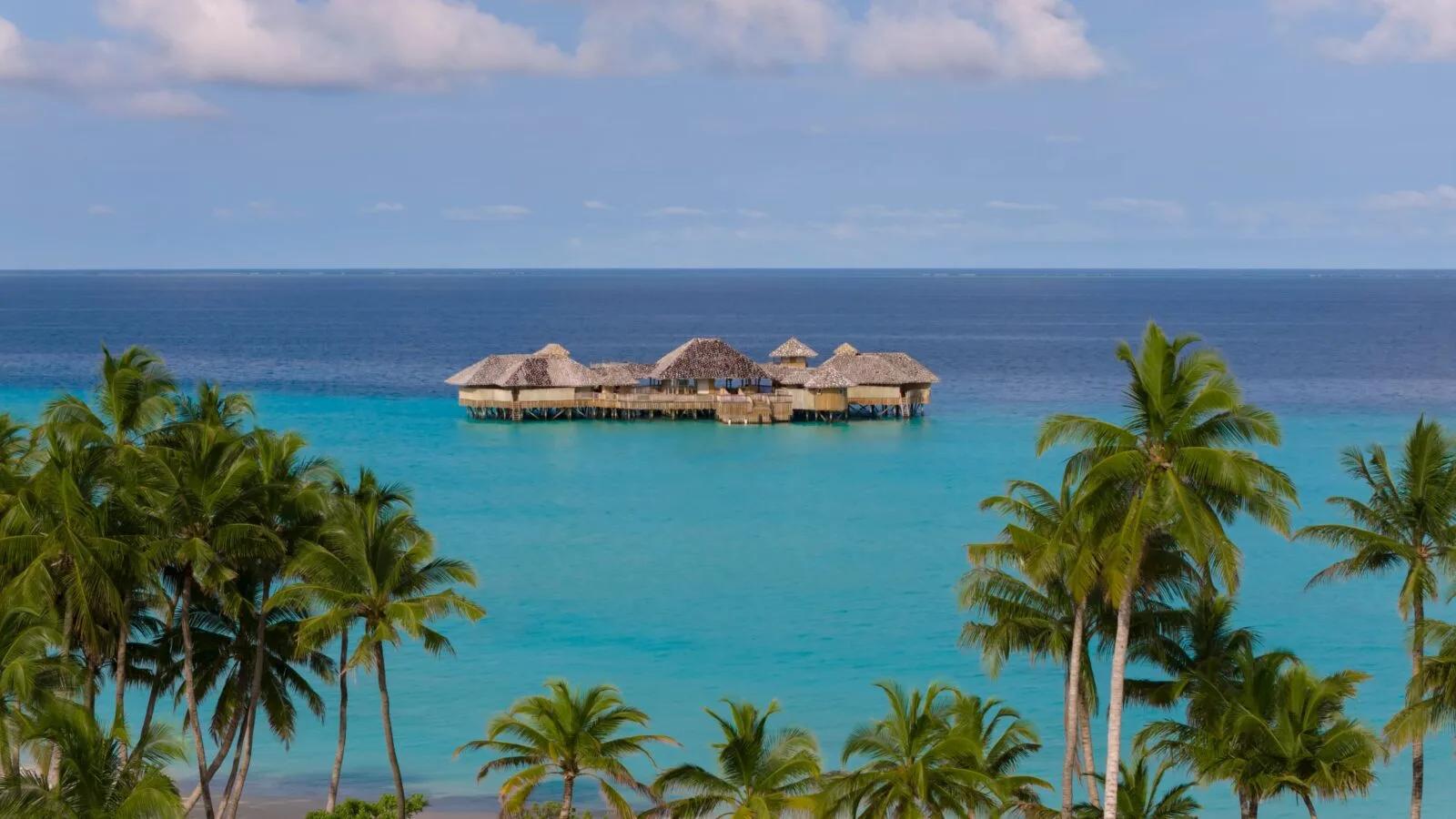 Soneva Secret's island seen from above, ringed by the private lagoon of Makunudhoo Atoll