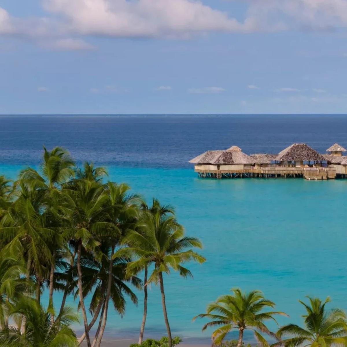 Soneva Secret's island seen from above, ringed by the private lagoon of Makunudhoo Atoll