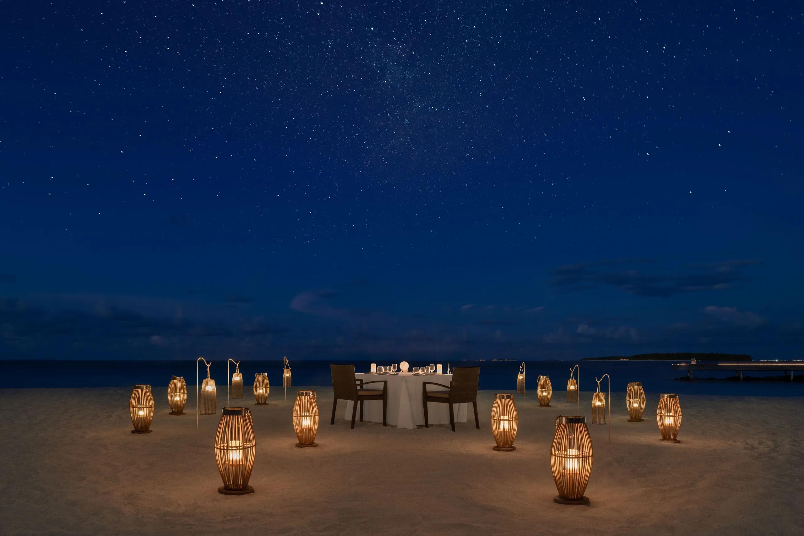 A private Starlight Dinner set up on the beach at The St. Regis Maldives Vommuli Resort