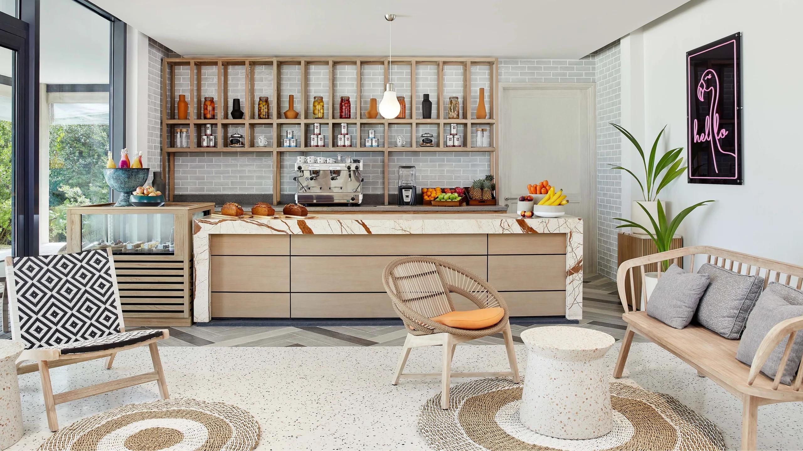 Waves Café's counter, with an espresso bar, pastries and fresh fruit